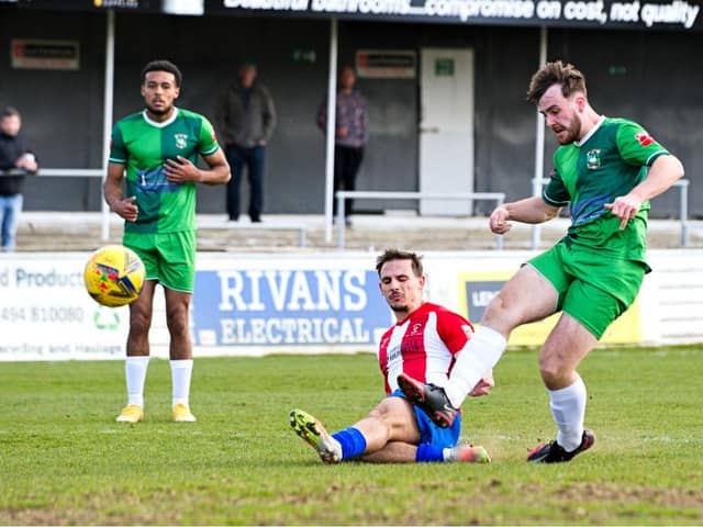 Harry Jones scoring the third goal for Ducks against Kempston Rovers Picture by Mike Snell