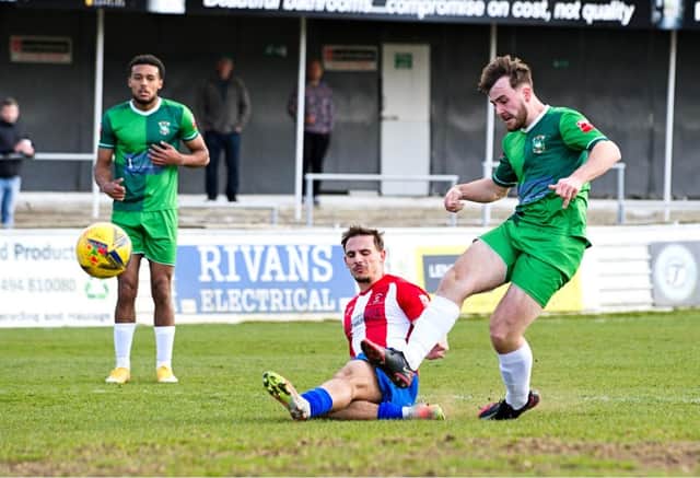 Harry Jones scoring the third goal for Ducks against Kempston Rovers Picture by Mike Snell
