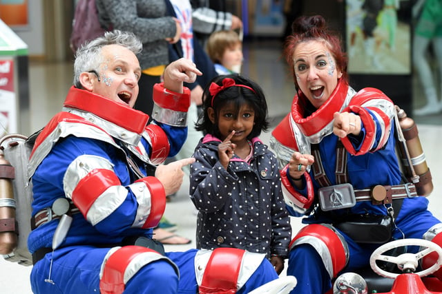 A pair of comedy astronauts glided round the shopping centre