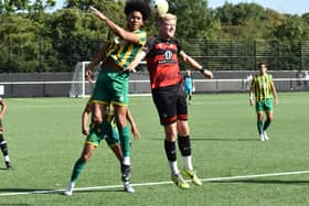 Jake Baldwin (right) challenges for the ball in Saturday's win for Aylesbury Vale Dynamos. Photo: AVDFC.