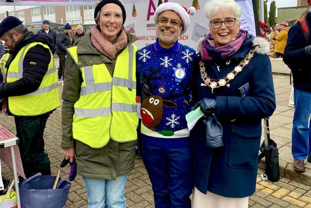 Street Trader Jane Barnes on left with ), BJ Tailor from Tesco centre and Mayor Cllr Elizabeth Shepherd taken outside AAG's stall at the Christmas Festival last year. Photo from Charlie Smith, Local Democracy Reporting Service