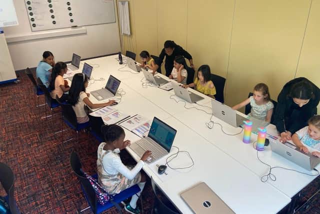 The girls getting stuck in with the coding activities.