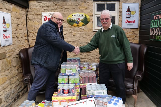 Richard Gordon of Greedy Gordons with Kettering Foodbank volunteer driver Ken Ansdell.