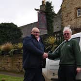 Richard Gordon of Greedy Gordons with Kettering Foodbank volunteer driver Ken Ansdell.