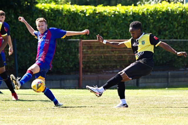Aylesbury's Evans Lamboh with an early strike at goal during Saturday's tie. Photo by Mike Snell.