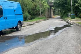 The stream passing down the road