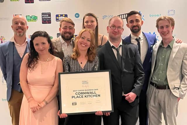 Sarah, George and the Cornwall Place Kitchen team receiving the award