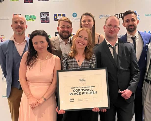 Sarah, George and the Cornwall Place Kitchen team receiving the award