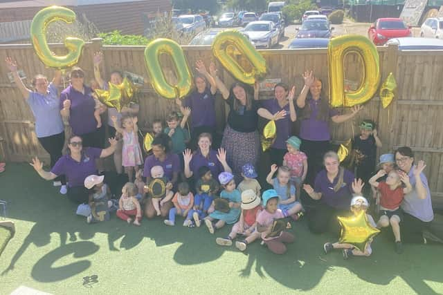 The children and team at Kiddi Caru Day Nursery in Leighton Buzzard celebrating their ‘Good’ Ofsted 