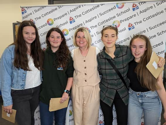 Top performing students Laura Clark-Monks,  Eleanor Tollyfield, Emma List and Tallulah Cotgrave with Mrs Smith Deputy Head of Sixth Form (middle).