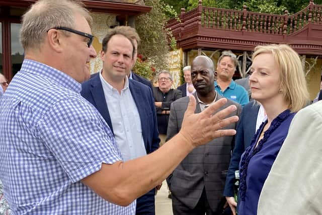 Liz Truss talks to party members at Waddesdon Cricket Club