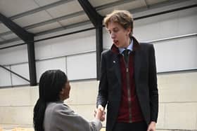 NOVEMBER 17: James McAlpine, 22, who stands at 7ft 2in, towers over the 5ft 4in Conservative Leader Kemi Badenoch as they meet at Fleet Marston Farm The Conservative party leader promised a review of bureaucratic "red tape" faced by farmers. (Photo by Leon Neal/Getty Images)