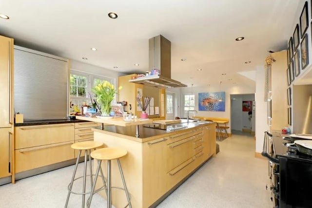 The modernised kitchen is filled with modern appliances and plenty of cooking and dining space.