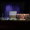 STAR NAME … Aled Jones (seated) with members of the Sing Out for Mental Health joint choirs