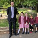 Cllr Gareth Williams with school administrator Carly Busby and pupils at Haddenham Community Infant School
