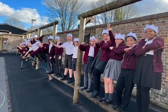 Pupils from Thomas Harding Junior School wearing the paper hats they made