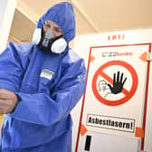 A photo of asbestos removal preparation used illustrative purposes (Photo by Tobias SCHWARZ / AFP) (Photo by TOBIAS SCHWARZ/AFP via Getty Images)
