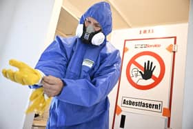 A photo of asbestos removal preparation used illustrative purposes (Photo by Tobias SCHWARZ / AFP) (Photo by TOBIAS SCHWARZ/AFP via Getty Images)