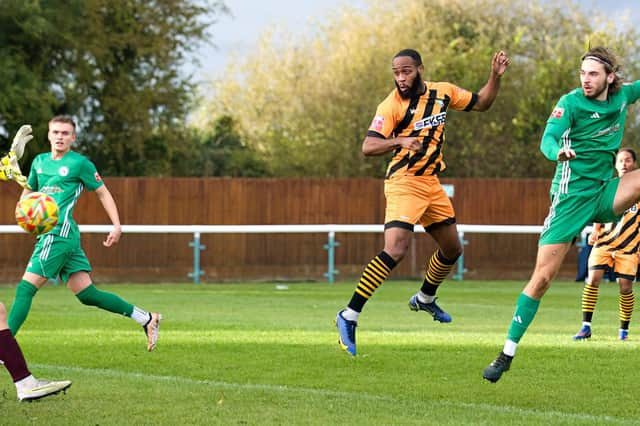 Ken Feyi heads home the opener at Biggleswade. Photo: Mike Snell.