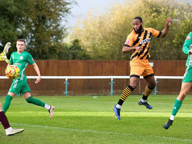Ken Feyi heads home the opener at Biggleswade. Photo: Mike Snell.