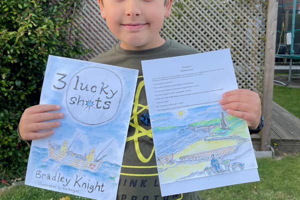 Bradley clutching his winning short story
