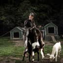 Kelly May with the farm's goats - Pete Muller/ Animal News Agency