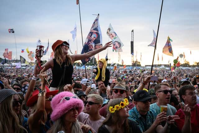 Revellers pictured at Glastonbury Festival 2024 at Worthy Farm, Pilton on June 29, 2024 (photo by Leon Neal/Getty Images). There are calls for Kneecap to be dropped from the bill for the 2025 event