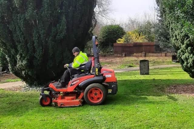 Greenspaces Team member Ian mowing grass