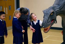 Reggie the animatronic T-Rex with a pupil at one of the Giant Journeys workshops.