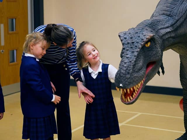 Reggie the animatronic T-Rex with a pupil at one of the Giant Journeys workshops.