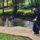 River Rinse volunteers in the water and on the river bank