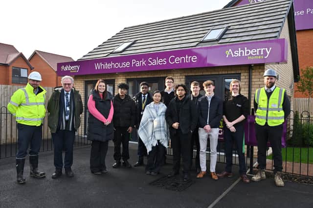 The Hazeley Academy staff and students with Ashberry Homes Contracts Manager Pete Bourne and Site Manager Sean Howard.