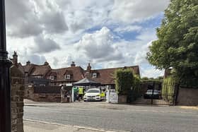 A marked police car being used during filming in Old Amersham, with production crew gathered nearby (Image: Nathaniel Lawson/LDRS)