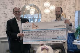 Simon West (left) from Buckingham &amp; Winslow Young Carers receives the cheque from David Babister