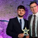 Ryan Crick collects his award from Tony Cockcroft