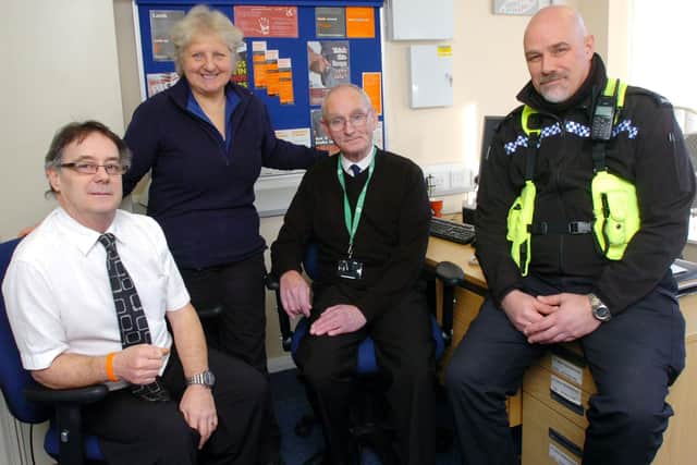 Inside Winslow Police Office in 2012:  PCSO Wendy Taylor and PC Martin Siderman with front office volunteers Andy Dyke and Rod Gibbard