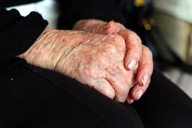 The hands of an elderly woman at home used for illustrative purposes. Photo from Peter Byrne PA Images