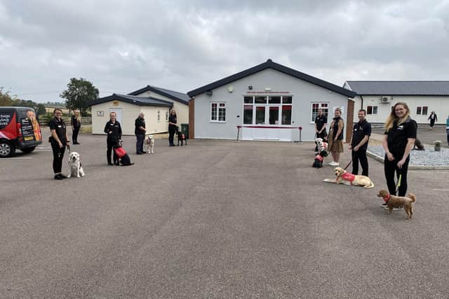 Medical Detection Dogs and their handlers outside the new building