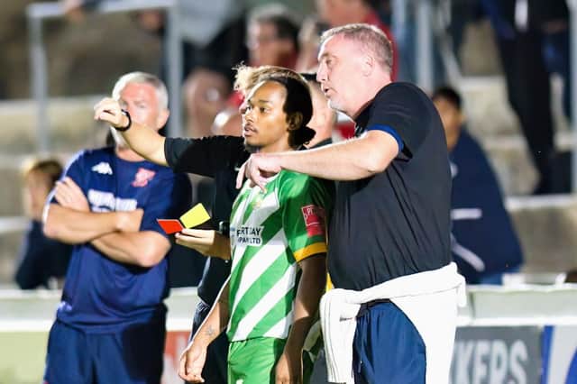 Dave Tuttle (right) gives out instructions on the touchline. Photo: Mike Snell.