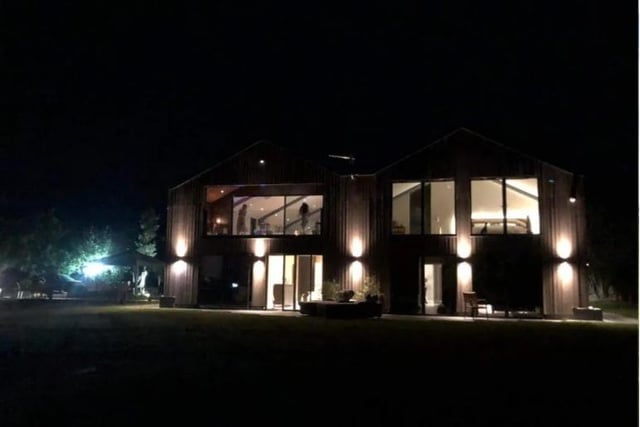 The house lit up at night