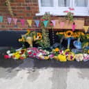 Floral tributes have been left outside The White Swan pub in Whitchurch following the death of its manager Becca Bullock