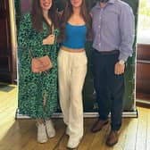 Izzy with her parents on results day.