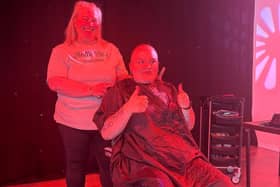 Mina on stage post head shave 2025