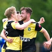 Celebrations and congratulations after Jamie Rudd scored the opening goal for Ducks against Bedford Town  Picture by Mike Snell