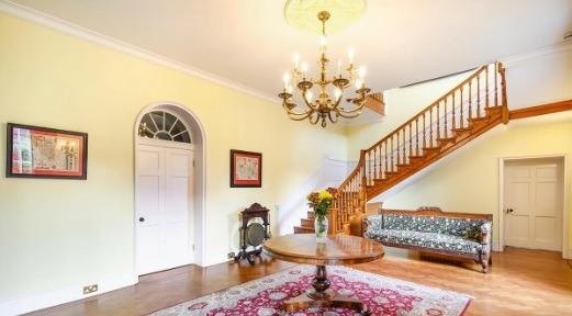 The grand entrance hall to this massive house which contains well over 20 rooms.