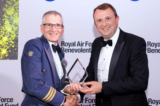 Mike receiving his 'Above and Beyond' award, photo by Oliver Dixon