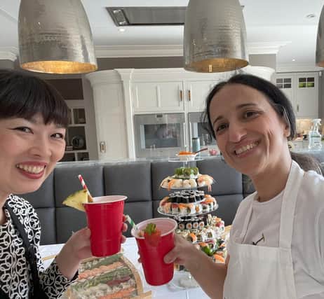 Tomono and Homa from Tomono Sushi Party after creating the sushi tower, sushi boat and sashimi bowl