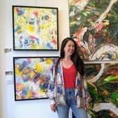 Jill Blakey with some of her paintings