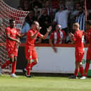 Callum Stead celebrates after he opened the scoring in Brackley Town's 2-0 win over Scarborough Athletic on the opening day of the season. Picture by Peter Keen