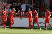 Callum Stead celebrates after he opened the scoring in Brackley Town's 2-0 win over Scarborough Athletic on the opening day of the season. Picture by Peter Keen